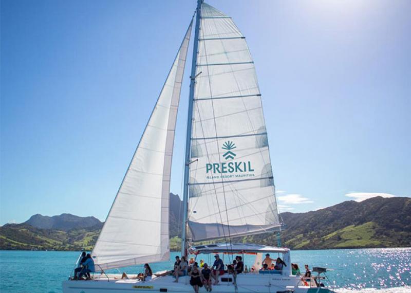 Catamaran on the sea with hills on the horizon