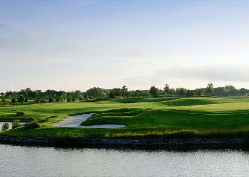 lighthouse golf course view with bunkers and water obstacles