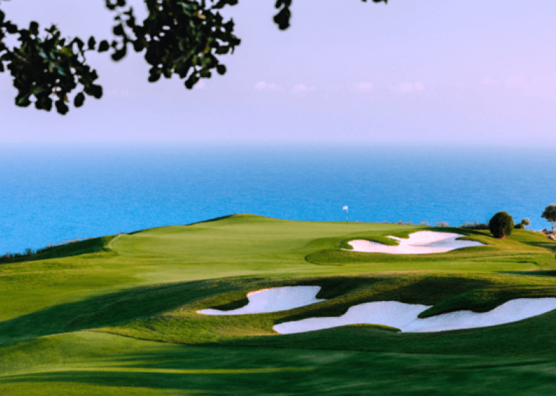 Aphrodite Hills fairway and bunkers view at sunset