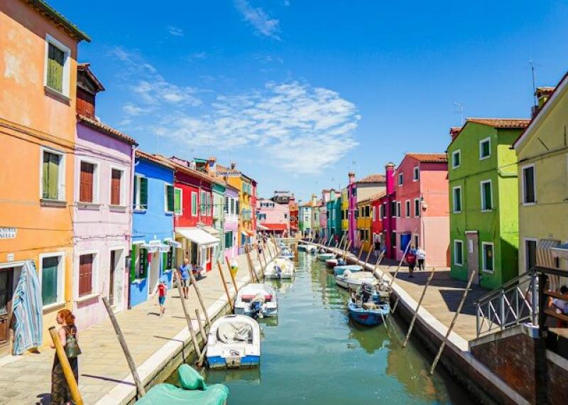 Canal in Burano with typical colored buildings