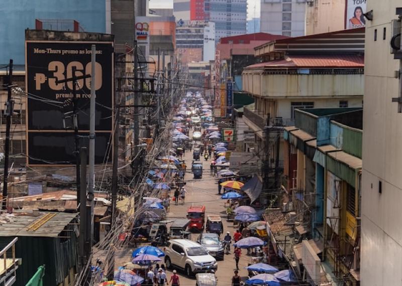 Manila street with stores and street food